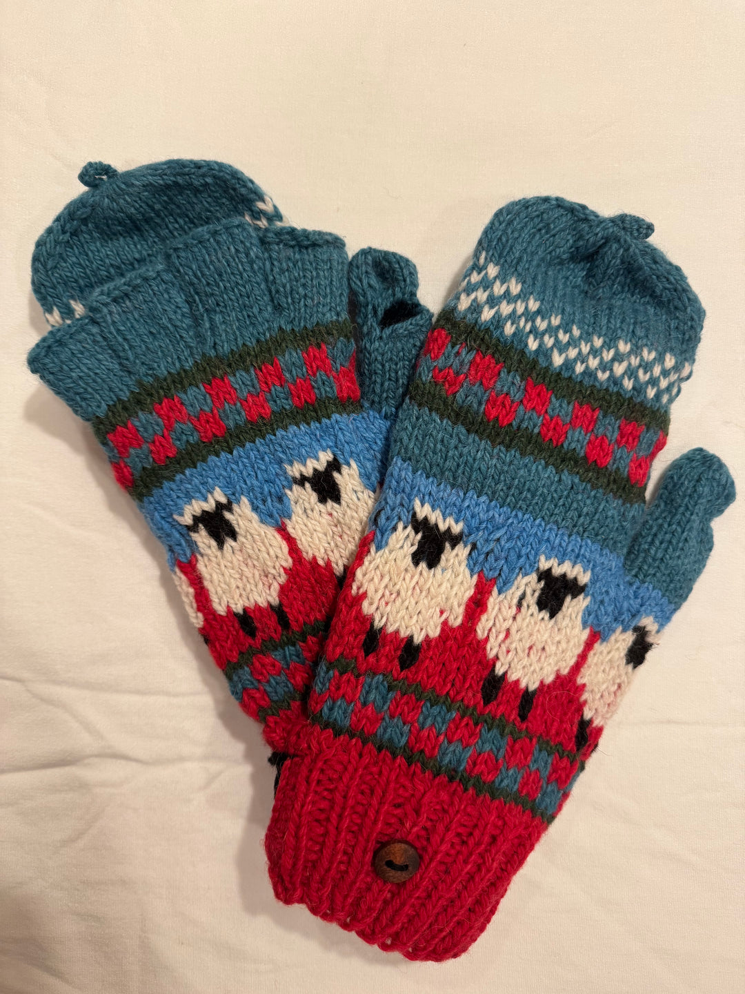 Convertible fingerless gloves with a mitten flap — knitted sheep across the back, 100% alpaca, hand-knit in Bolivia