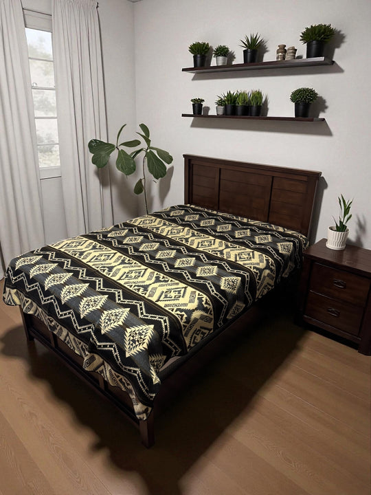 Cuzco Stone Alpaca Wool Blanket styled on bed — artisan-made Ecuadorian textile from Enchanted Farms
