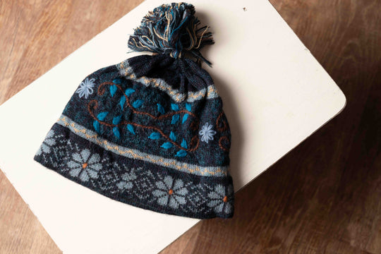 Mariana alpaca hat in teal with a hand-knit fern pattern, made in Peru