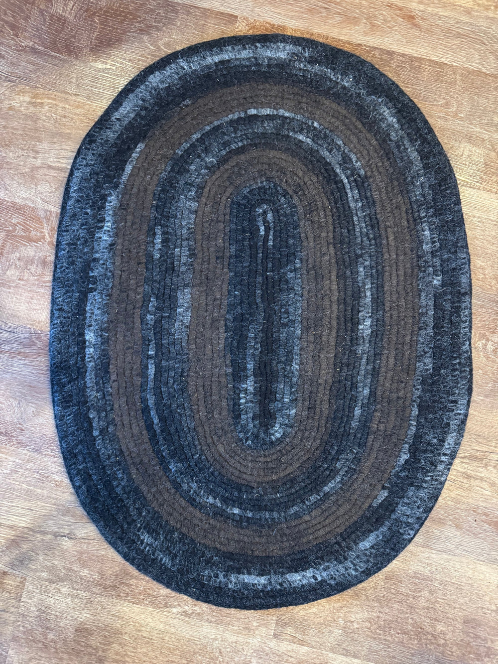 Handmade alpaca felt rug in dark brown, gray and black