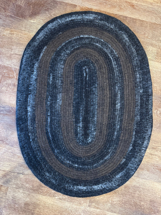 Handmade alpaca felt rug in dark brown, gray and black