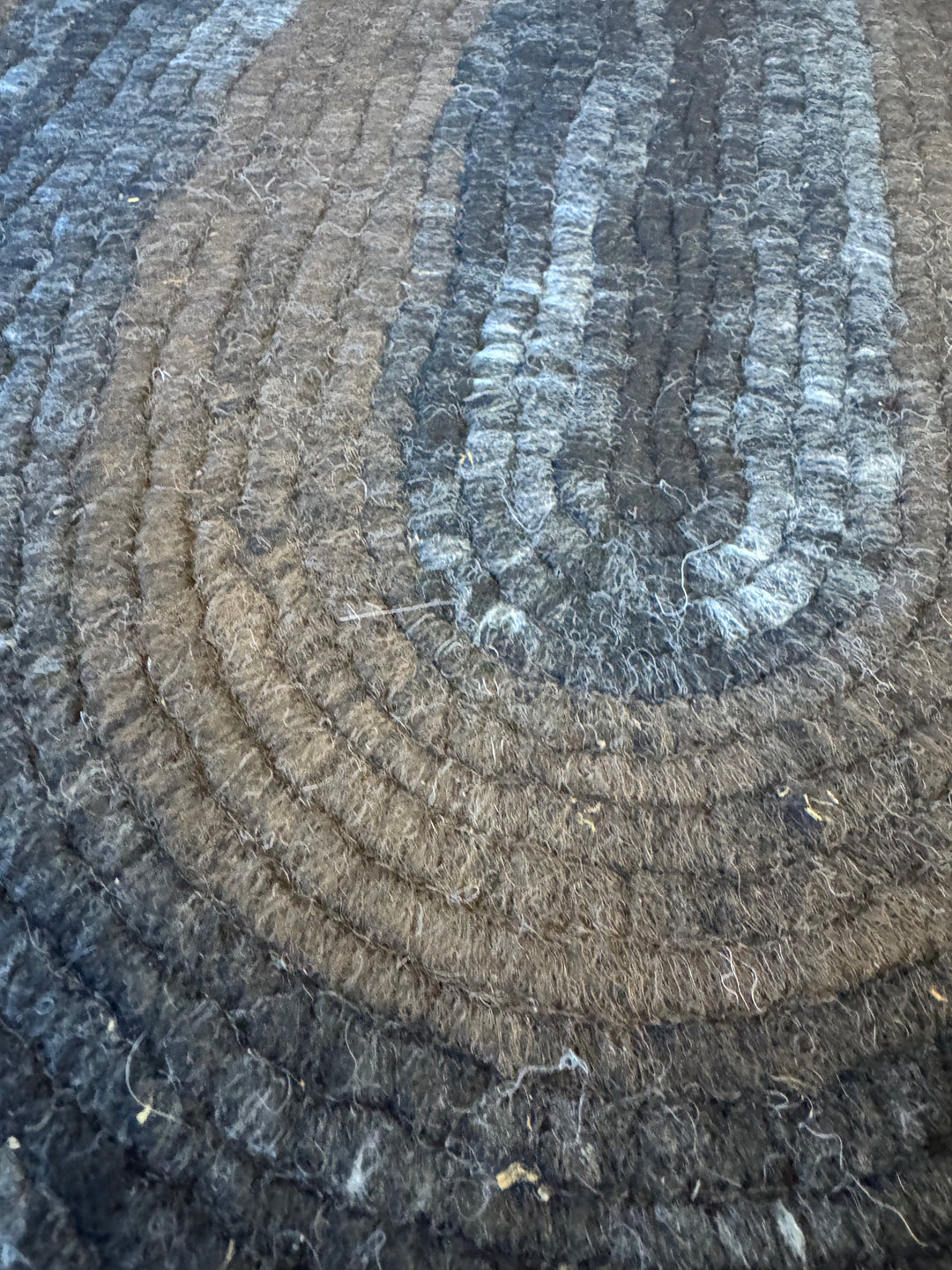 Handmade alpaca felt rug in dark brown, gray and black, from Enchanted Farms in Duvall, Washington