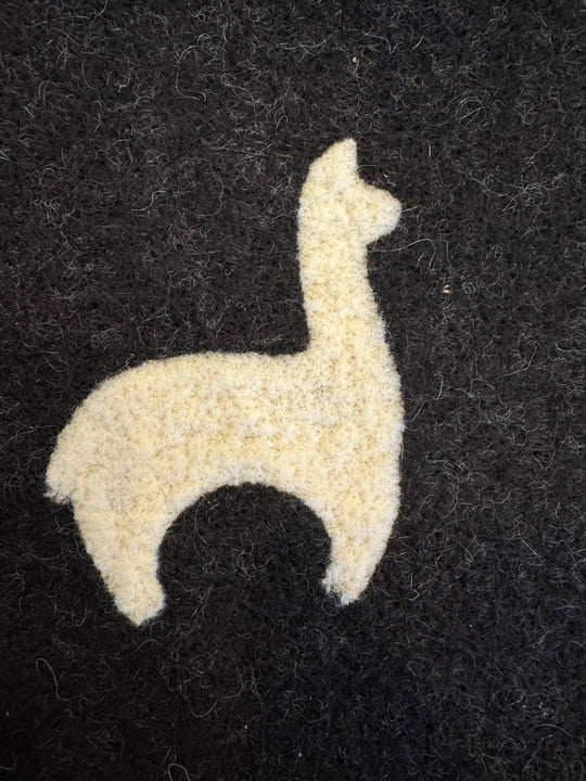 Close-up of the handmade alpaca felt rug