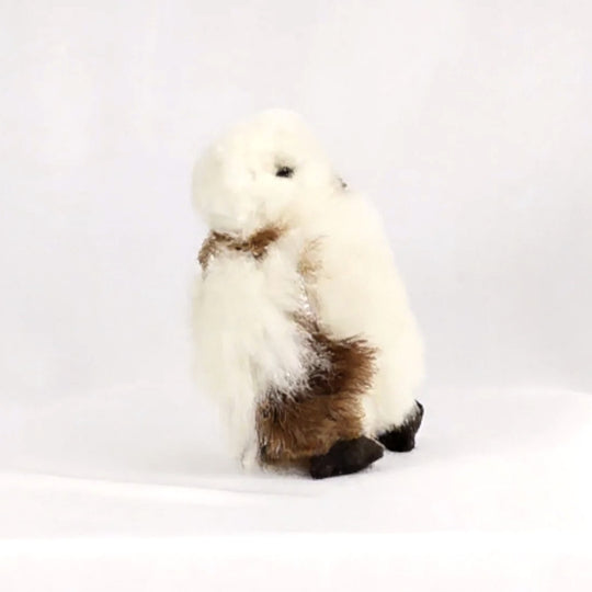 Hedwig the Owl, a fluffy cream alpaca stuffie with brown speckles