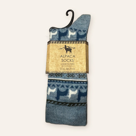 Sky blue alpaca socks with navy and white alpaca pattern, made in Peru